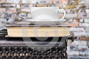Old typewriter and coffe cup