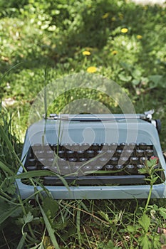 Old typewriter on the grass