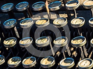 Old typewriter keyboard with dust in the sun