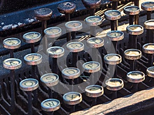 Old typewriter keyboard with dust in the sun