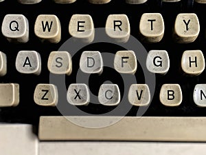 Old typewriter keyboard in vintage background. Stock photo.