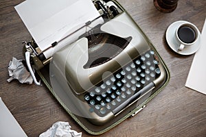 Old typewriter, paper, coffee