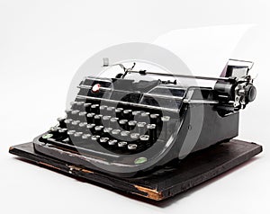 Old typewriter with a sheet of paper