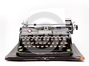 Old typewriter with a sheet of paper
