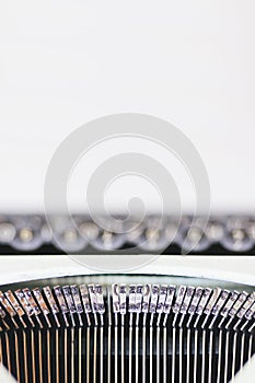 Old typewriter on white background