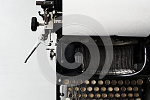 Old typewriter on white tabletop