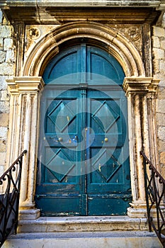 Old typical green painted wood door