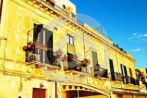 Old typical windows in Ortigia. Sicily