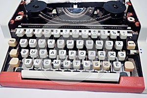 Old typing machine with Russian alphabet. Color photo.