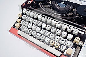 Old typing machine with Russian alphabet. Color photo.