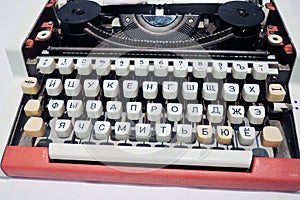 Old typing machine with Russian alphabet. Color photo.