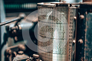 Old typography printing machine with letter samples.