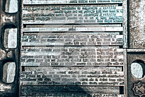 Old typography printing machine with letter samples.