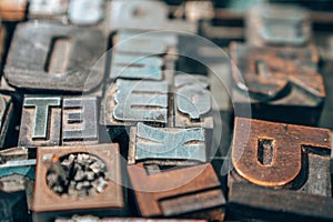 Old typography printing machine with letter samples.
