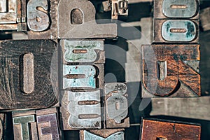 Old typography printing machine with letter samples.