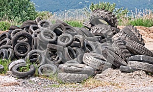 Old tyres- aka tires - in landscape