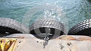 Old tyres hanging on port of karakoy istanbul