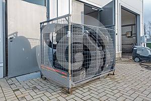 old tyres pile up in front of a garage to be disposed of