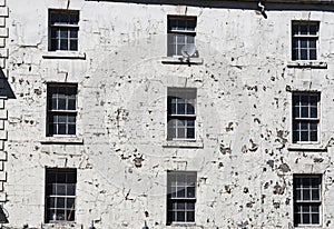 Old UK building with flaking white paint