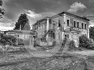 The old uninhabited half-ruined house with broken out