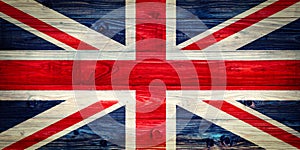 An old Union Jack on wooden surface