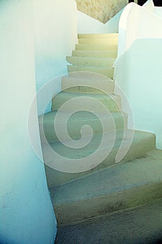 Old unique white and yellow steps in Oia, Santorini, Greece