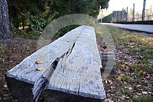 An old unpainted bench in the park