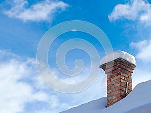 Old, unused chimney covered with snow