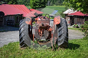 Old unused rusty tractor in a farm, USA