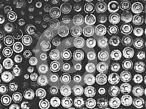 Old used batteries group. Top view background texture. Black and white