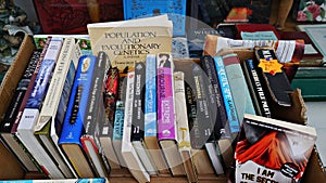 Old used books in a box outside an antique book shop