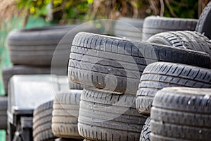 Old used car tires. A pile of black tires, abstract background.