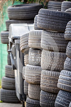 Old used car tires. A pile of black tires, abstract background.
