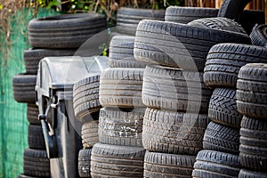 Old used car tires. A pile of black tires, abstract background.