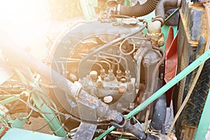 Close-up of an old used diesel engine with rusty and dirty car parts, water infiltration and poor car maintenance