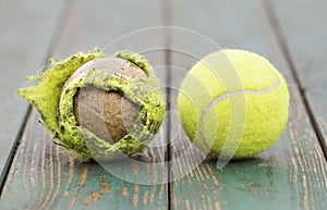 Old used dirty and new tennis balls