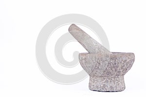 Old used granite stone mortar and pestle are Thai cooking tool on white background food isolated