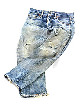 Old used jeans trousers isolated