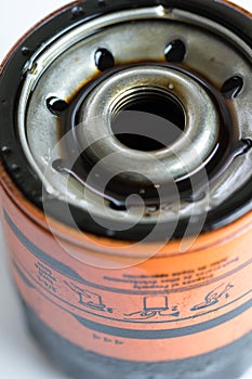 old used motor oil filter close up shot.