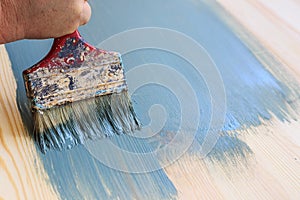 Old used paint brush painting wood background