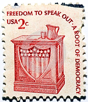 An old used postage stamp printed in USA shows Freedom to speak out - Speaker's Stand, 2 cents 1975