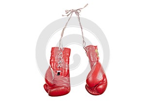 Old used red leather boxing gloves with laces, isolated on white background