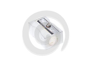 Old used white plastic pencil sharpener isolated on white.