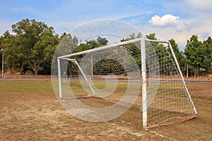 Old vacant football soccer goal gate in rural grass field in Chiang Mai,Thailand