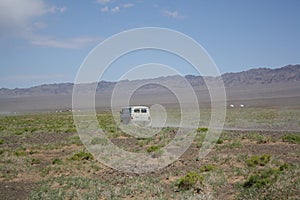 An old van in the vast Gobi Desert, Umnugovi, South Mongolia.