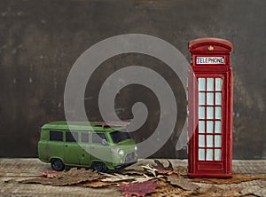 Old van and vintage red phone booth