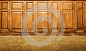 Old varnished wooden hinged cupboards