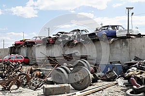 Old vehicles in an auto salvage yard photo