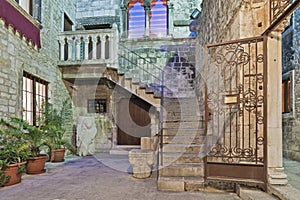 The old venetian stone court with stair. Split, Croatia