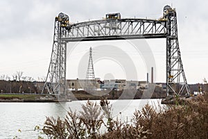 Old Vertical Lift Bridge across a Ship Canal in Autumn